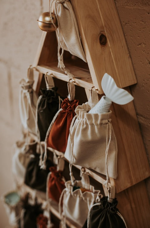 Wooden advent calendar with little bags for calendar fillers, presents and treats
