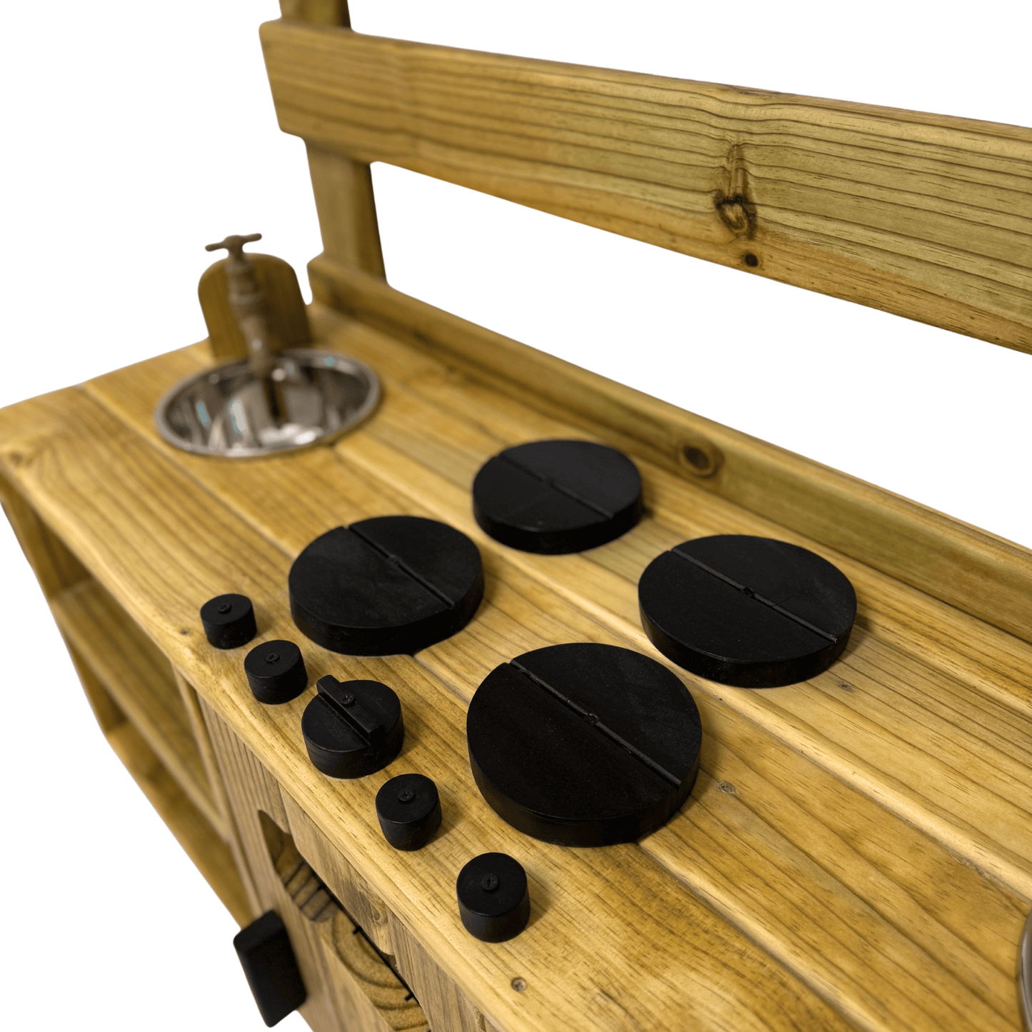 Wooden stove hob detail on the Double Mud Kitchen, featuring handcrafted black knobs and burners for pretend play.