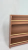 Classic Bookshelf with Front Rail in Terracotta and Varnish finish, designed to display children's books front-facing for easy browsing and independent reading.