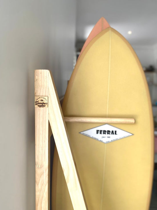 Side view of the Standard 6 peg Surfboard Stand with foam protective layer on base.